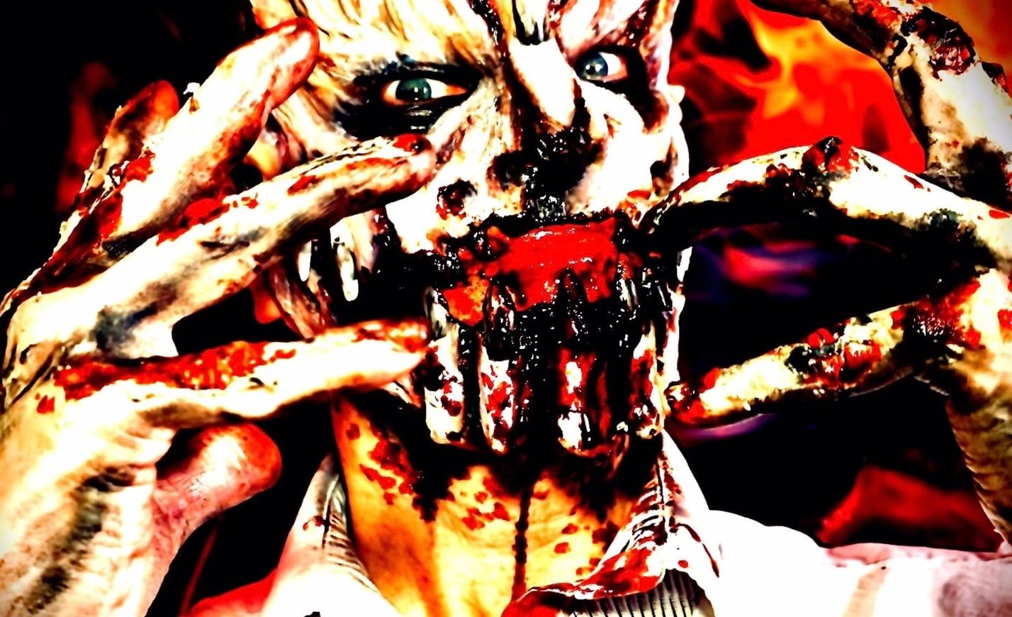 Close-up of a person with intense horror makeup and fake blood.